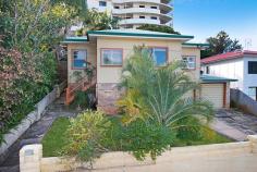  9 Angela Street Tweed Heads NSW 2485 OPEN TO INSPECT BY APPOINTMENT  Step back in time with this high set (3) bedroom 'retro style' residence which offers a wonderful lifestyle on the fringe of Tweed & Coolangatta conveniences and glorious local beaches.  In addition, the lower (ground) section of the home has its own private access, is partially converted with toilet and plumbing in place & is ideally set up to facilitate an extension, dual living options & or home office.  KEY FEATURES:  - Stunning cool polished timber flooring  - Generous living w/ split system air-conditioning  - Modernised bathroom  - Striking red stone kitchen bench w/ vintage cabinetry  - Two separate lock up garages (plus large workshop area)  - Lower section partially fitted room out with toilet & plumbing  DETAILS:  Block Size - 519m2 elevated allotment  Zoning - R3, medium density residential - height to 49.5m  Market Rent - $485-$495 per week  Rates - $TBA  Water - $TBA  LOCATION:  Angela Street is within an elevated leafy area, where you can virtually leave your car at home and take an energetic walk into town or stroll down to the park with your pooch in tow.  You will enjoy the very best of both worlds that both Coolangatta & the Tweed has to offer at a moment's notice, including major shopping, medical & sporting facilities.  For Surfers & bathers, you will have your toes in the sand in less time that it takes to wax your board.  Gold Coast International Airport & Southern Cross University are within (5) minutes.  AGENT'S COMMENTS:  A vintage property that has scope to add value, plus the potential for development & amalgamation with neighbouring homes.  If you crave the convenience without the price tag, then this property is much more than a step in the right direction. 
