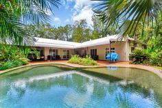  30 Parakeet Pl, Howard Springs NT 0835 THE FEATURES Sizeable family 4-5 bedroom, 2-3 bathroom home on 5 acres of tropical bliss Gated front driveway provides formal entrance Bitumised driveway is high and dry year round Tropical gardens screen the home for ultimate privacy Gorgeous home has roll front verandah Carport parking for 2 plus a built-in dog lock up Verandah spans front of home and wraps around back of home Gorgeous in ground swimming pool with rockery feature Home has enormous living room with separate dining room Central kitchen has breakfast bar plus pantry 3 bedrooms plus study at the front of the home Large master suite enjoys ensuite and walk in robe Main bathroom includes a relaxing bath tub Huge shed has built in office / FULLY SELF CONTAINED FLAT with additional bathroom 2 registered bores and town water Established tropical gardens and rolling green lawns around home Property located 5 minutes from Howard Springs shops Easy access to the Ichthys accommodations 5 minutes from the popular Howard Springs Park 10 minutes from Palmerston CBD THE BENEFITS Located in a quiet area in this supremely popular estate, this established family home has lush tropical gardens and sprawling lawn areas surrounding a home that requires naught – simply move in and enjoy it as much as the current owners do. The home is extremely well looked after by proud owners who tend to its every need. Inside is an expansive open living room with tiled flooring, glass fronted French Doors that open onto the verandahs that wrap around 3 sides of the home offering bountiful entertaining space under its shaded roof. Back inside, the home has a central kitchen with two-way access to both the dining and living rooms. The kitchen also includes a large pantry, great storage and prep space, a dishwasher plus a breakfast bar as well as quality appliances throughout. The home offers 4 bedrooms that each have A/C and a built-in robe along with large windows that frame the tropical greenery from outside. The master also enjoys a walk-in robe and en-suite amenities plus there is a study or small 5th bedroom option as well. Endless hours will be spent splashing in this tropical oasis with a large in ground swimming pool nestled at the base of tall palms. The area has a large paved portion where you can entertain under the stars or sunbake while the kids splash about. Also on the property is an enormous workshop shed with a built-in office or granny flat and bathroom amenities, additional verandah area plus RWT and a side parking bay as well. Located a short 5 minute drive from the popular Howard Springs Park and the shops, the home is also under 10 minutes from Palmerston CBD making it the ultimate rural retreat without compromising on your everyday necessities. THIS PROPERTY HAS BEEN PRICED BY A BANK VALUATION TO PROVIDE ACCURATE AND COMPETITIVE VALUE TO YOU THE BUYER. Book your private inspection today. 