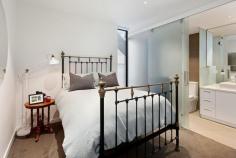  109/102 Rankins Road Kensington VIC 3031 Epitomising the ultimate in modern design and quality, this executive, as new one bedroom plus study residence within “The London” boutique apartment complex is ideally located on a picturesque tree-lined street, close to Kensington train station, Macaulay Road shopping and cafe precinct and just 4km from the CBD. Generous open plan living spills onto a large, full-width entertaining balcony via broad glass bi-fold doors, seamlessly and fashionably bringing the outdoors in. Coupled with the gourmet kitchen boasting stone bench tops, smoked glass mirrored splashbacks, soft close drawers, state-of-the-art Neff stainless steel appliances including induction cooktop and semi-integrated dishwasher, entertaining is nothing short of a dream. From the frosted glass sliding door separating the master bedroom and ensuite to the exclusive chrome fixtures, stone bench vanity and mirrored wall, the fully tiled bathroom is a statement in contemporary style. Video intercom entry and complex surveillance provide peace of mind for the security conscious, whilst split system air-conditioning ensures year round comfort. Other impressive features include secure parking bay, well-designed study nook, polished timber floorboards, storage cage, European laundry and sheer roller blinds. In a class of its own, “The London” will exceed your expectations and deliver the ultimate urban lifestyle. Features - Chic apartment featuring quality fixtures and finishes throughout - Spacious open plan living with huge private entertaining balcony - Fabulous stone bench kitchen with state-of-the-art stainless steel Neff appliances - Good sized bedroom with vogue ensuite bathroom, BIRs plus study nook - Split system air conditioning, quality flooring and great storage - Video intercom entry and undercover parking plus complex surveillance 