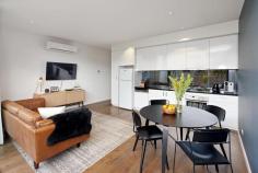  109/102 Rankins Road Kensington VIC 3031 Epitomising the ultimate in modern design and quality, this executive, as new one bedroom plus study residence within “The London” boutique apartment complex is ideally located on a picturesque tree-lined street, close to Kensington train station, Macaulay Road shopping and cafe precinct and just 4km from the CBD. Generous open plan living spills onto a large, full-width entertaining balcony via broad glass bi-fold doors, seamlessly and fashionably bringing the outdoors in. Coupled with the gourmet kitchen boasting stone bench tops, smoked glass mirrored splashbacks, soft close drawers, state-of-the-art Neff stainless steel appliances including induction cooktop and semi-integrated dishwasher, entertaining is nothing short of a dream. From the frosted glass sliding door separating the master bedroom and ensuite to the exclusive chrome fixtures, stone bench vanity and mirrored wall, the fully tiled bathroom is a statement in contemporary style. Video intercom entry and complex surveillance provide peace of mind for the security conscious, whilst split system air-conditioning ensures year round comfort. Other impressive features include secure parking bay, well-designed study nook, polished timber floorboards, storage cage, European laundry and sheer roller blinds. In a class of its own, “The London” will exceed your expectations and deliver the ultimate urban lifestyle. Features - Chic apartment featuring quality fixtures and finishes throughout - Spacious open plan living with huge private entertaining balcony - Fabulous stone bench kitchen with state-of-the-art stainless steel Neff appliances - Good sized bedroom with vogue ensuite bathroom, BIRs plus study nook - Split system air conditioning, quality flooring and great storage - Video intercom entry and undercover parking plus complex surveillance 