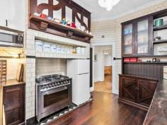  22 Market St, Guildford WA 6055 $830,000 Simply gorgeous (circa 1932) 5 x 2 brick & tile Art Deco home in walking distance to the SWAN RIVER, the Café strip, pubs, restaurants, transport, the exclusive Guildford Grammar School and only minutes from the airport & all the treats on offer in the Swan Valley. Boasting: • 	 High brick wall with electronic gates  • 	 Attractive front gardens with timber deck & seating area  • 	 Wide veranda – that perfect spot to relax  • 	 Impressive entrance with attractive Art Deco wall lights  • 	 Formal lounge with fireplace, ornate ceiling, stunning lead light window, French doors & Art Deco light fixtures  • 	 Dining room with ornate panelled ceiling, unique light fitting & lead light French doors  • 	 The timber kitchen is the hub of the home and has fitted cupboards to the ceiling, good bench space, stainless stove & dishwasher.  • 	 Private Master bedroom at the front with stunning lead light window  • 	 Three additional good sized bedrooms  • 	 Renovated white bathroom  • 	 Separate powder room  • 	 Library/Study with fitted bookshelves & lead light window  • 	 Spacious Family room with bi-fold doors to the alfresco entertaining area  • 	 Laundry and 2nd wc.  • 	 Pitched gabled alfresco area with extensive paving  • 	 Lush established gardens with veggie troughs  • 	 Cubby House & Chook pen  • 	 Powered workshop with timber shutter doors  • 	 Single garage with shopping entrance – ample off street parking  • 	 STUDIO – French doors adorned with timber shutters – sitting room, contemporary bathroom, r/c unit & gas bayonet. Additional features: High ornate ceilings, timber floors, lead light windows & French doors, some Art Deco light fittings, 4 x r/c units, electronic wrought iron gates, lush established auto reticulated gardens. Right of Way at the rear with gate to the back yard.  Side access Block size: 886m2 YOUR WAIT IS OVER! FEATURES Split-System Air Conditioning Courtyard Deck Fully Fenced Outdoor Entertainment Area Secure Parking Dishwasher Floorboards Study Workshop 