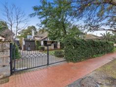  22 Market St, Guildford WA 6055 $830,000 Simply gorgeous (circa 1932) 5 x 2 brick & tile Art Deco home in walking distance to the SWAN RIVER, the Café strip, pubs, restaurants, transport, the exclusive Guildford Grammar School and only minutes from the airport & all the treats on offer in the Swan Valley. Boasting: • 	 High brick wall with electronic gates  • 	 Attractive front gardens with timber deck & seating area  • 	 Wide veranda – that perfect spot to relax  • 	 Impressive entrance with attractive Art Deco wall lights  • 	 Formal lounge with fireplace, ornate ceiling, stunning lead light window, French doors & Art Deco light fixtures  • 	 Dining room with ornate panelled ceiling, unique light fitting & lead light French doors  • 	 The timber kitchen is the hub of the home and has fitted cupboards to the ceiling, good bench space, stainless stove & dishwasher.  • 	 Private Master bedroom at the front with stunning lead light window  • 	 Three additional good sized bedrooms  • 	 Renovated white bathroom  • 	 Separate powder room  • 	 Library/Study with fitted bookshelves & lead light window  • 	 Spacious Family room with bi-fold doors to the alfresco entertaining area  • 	 Laundry and 2nd wc.  • 	 Pitched gabled alfresco area with extensive paving  • 	 Lush established gardens with veggie troughs  • 	 Cubby House & Chook pen  • 	 Powered workshop with timber shutter doors  • 	 Single garage with shopping entrance – ample off street parking  • 	 STUDIO – French doors adorned with timber shutters – sitting room, contemporary bathroom, r/c unit & gas bayonet. Additional features: High ornate ceilings, timber floors, lead light windows & French doors, some Art Deco light fittings, 4 x r/c units, electronic wrought iron gates, lush established auto reticulated gardens. Right of Way at the rear with gate to the back yard.  Side access Block size: 886m2 YOUR WAIT IS OVER! FEATURES Split-System Air Conditioning Courtyard Deck Fully Fenced Outdoor Entertainment Area Secure Parking Dishwasher Floorboards Study Workshop 