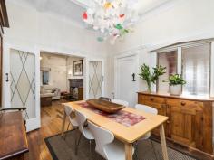  22 Market St, Guildford WA 6055 $830,000 Simply gorgeous (circa 1932) 5 x 2 brick & tile Art Deco home in walking distance to the SWAN RIVER, the Café strip, pubs, restaurants, transport, the exclusive Guildford Grammar School and only minutes from the airport & all the treats on offer in the Swan Valley. Boasting: • 	 High brick wall with electronic gates  • 	 Attractive front gardens with timber deck & seating area  • 	 Wide veranda – that perfect spot to relax  • 	 Impressive entrance with attractive Art Deco wall lights  • 	 Formal lounge with fireplace, ornate ceiling, stunning lead light window, French doors & Art Deco light fixtures  • 	 Dining room with ornate panelled ceiling, unique light fitting & lead light French doors  • 	 The timber kitchen is the hub of the home and has fitted cupboards to the ceiling, good bench space, stainless stove & dishwasher.  • 	 Private Master bedroom at the front with stunning lead light window  • 	 Three additional good sized bedrooms  • 	 Renovated white bathroom  • 	 Separate powder room  • 	 Library/Study with fitted bookshelves & lead light window  • 	 Spacious Family room with bi-fold doors to the alfresco entertaining area  • 	 Laundry and 2nd wc.  • 	 Pitched gabled alfresco area with extensive paving  • 	 Lush established gardens with veggie troughs  • 	 Cubby House & Chook pen  • 	 Powered workshop with timber shutter doors  • 	 Single garage with shopping entrance – ample off street parking  • 	 STUDIO – French doors adorned with timber shutters – sitting room, contemporary bathroom, r/c unit & gas bayonet. Additional features: High ornate ceilings, timber floors, lead light windows & French doors, some Art Deco light fittings, 4 x r/c units, electronic wrought iron gates, lush established auto reticulated gardens. Right of Way at the rear with gate to the back yard.  Side access Block size: 886m2 YOUR WAIT IS OVER! FEATURES Split-System Air Conditioning Courtyard Deck Fully Fenced Outdoor Entertainment Area Secure Parking Dishwasher Floorboards Study Workshop 