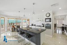 8 Wickham Court, Chirnside Park, VIC 3116, Australia $820,000 - $870,000 Family Living, Alfresco Sensation Quiet and tree lined streetscape within popular Chirnside Village sets a desirable and appealing tone for this wonderful family home. - Experience the fluidity of the generous light infused and spotless interior geared towards family relaxation and brilliant alfresco entertaining. - Delivering a spacious, welcoming floor plan, comprising entry hallway, study with store room, lounge, huge informal zone featuring a stylish, well equipped kitchen with breakfast bar-dining-family area warmed by the charms of a wood heater.  - This entire zone overlooks the massive Northerly undercover deck and easy care garden. This established allotment measures 702 square metres approx. - Making this retreat the ideal go to place for a BBQ, brunches and casual dining on a big scale.  - Offering four robed bedrooms in total, highlighting the spacious zoned main bedroom with loads of built in robes and a modern ensuite. A walk in robe complements one of the additional bedrooms. - The light filled bathroom services the remaining bedrooms plus separate WC. 