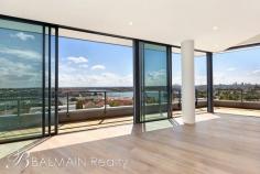  602/1 Nagurra Place Rozelle NSW 2039 $3,500,000 Taking in a commanding outlook with sweeping northerly harbour views from every room, this luxurious Penthouse apartment is situated within the 'Union Balmain' development approximately 18 months old. Offering expansive harbour views toward the Blue Mountains over Iron Cove Bay, to the Sydney Harbour Bridge, Sydney "Centrepoint" Tower, Barangaroo & the city skyline this magnificent north facing apartment will please the most discerning of buyers. Property features include; - Three well appointed bedrooms all feature harbour views. Master bedroom with walk-in wardrobe & en-suite with walk-in shower and bath - Additional home office/ study - Premium fixtures & fittings including wide American Oak floors, stone benches with timber detailing, automated blinds & retractable fly screens - Spacious light-filled interiors with cathedral ceilings, skylights and a sunny northerly aspect - Sleek designer kitchen with island bench top featuring breakfast bar with stainless appliances featuring gas cooking, dishwasher, microwave and integrated fridge/freezer - Designer bathrooms with upgraded marble vanity stone & mosaic tiling - Separate internal laundry with washing machine & dryer - Ducted air-conditioning & ceiling fans throughout - Secure basement parking for 2-3 vehicles with 2 storage cages - Direct lift access to apartment from parking & lobby entrance, with level walk-in access to building (no stairs) - Security access, video intercom & on-site building manager - Positioned on the top floor (level 6) - 5 Star Green Star multi-residential building - Landscaped grounds with a rooftop garden complete with BBQ and entertaining facilities along with a communal vegetable garden - Neighbourhood gourmet grocer & cafe, barber, day spa, bottle shop and a selection of restaurants - Only a moments stroll from express public transport, The Bay Run, Bridgewater Park & the harbour foreshore along with Darling Streets array of cafes, restaurants, pubs & boutique shops INSPECT AS ADVERTISED OR BY PRIVATE APPOINTMENT Balmain Realty "Real Estate Solutions for the Balmain Peninsula & Inner West" (Every precaution has been taken to establish accuracy of the above information but does not constitute any representation by the vendor or agent) 