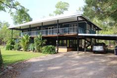  10 Zill Rd, Girraween NT 0836 $759,000 negotiable Two hectares (5 acres) fully fenced selectively cleared with lush gardens and manicured lawns fully reticulated and serviced by a 7 litre per second water bore. Coded 5 bedroom, 3 bathroom elevated home is neat as a pin, freshly painted internally. 2 Living areas with 4 bedrooms and 2 bathrooms upstairs and spacious 1 bedroom self contained granny flat with bathroom downstairs with attached 8m x 12m screened entertainment area.. Huge main bedroom with en-suite. Modern kitchen with granite bench tops, lots of cupboards and walk in pantry. Full length verandahs front and rear overlooking the nice gardens and pool area. Coded 14m x 6m full concreted carport. Splash out in the 90,000 litre in ground concrete swimming pool, pebble creted and with lavish sandstone finishes, large shade sail. Fully coded 16m x 17m masonry block walled shed / workshop (272 SQM) concrete floor area with high ceiling space and has 3 phase power. Ideal location for family with children, walking distance to Girraween Primary School and three minute drive to Coolalinga shopping hub and twenty minute drive to Darwin City. 