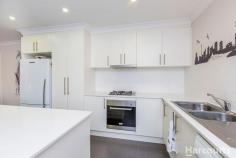  69 Bieundurry St, Bonner ACT 2914 $680,000 + This immaculately presented family home features a flowing floorplan that spreads across 4 bedrooms, 2 living spaces, luxurious interiors and abundance of natural lights throughout. Located in a nice street with quality homes around, this home offers beautiful mountain views from the open plan family and kitchen which features island stone benchtop and quality appliances. The north facing covered entertaining deck is perfect for those who enjoy the option of entertaining both indoor or outdoor all year round. This home boasts 4 spacious bedrooms, segregated master suite with stylish en suite and walk-in robe to give luxury and privacy to parents. Other 3 bedrooms are good sized, all with built in robes. The main bathroom with full height porcelain tiling, semi-frameless shower screens and bath tub is complemented by a separate toilet Bonner is becoming the suburb of choice for buyers in Gungahlin due to established facilities, schools, shops, public transport as well as close proximity to the new Amaroo shops and Gungahlin town centre. Features Include: - 	 Segregated main bedroom with walk-in robe and en suite - 	 Three other good size bedrooms with built-in robes - 	 Two separate livings, formal lounge with privacy blinds - 	 Gourmet kitchen with 20 mm thick island stone benchtop, gas cooktop, oven, dishwasher, soft close drawers and ample storage options  - 	 Combination of tiles and carpet flooring - 	 Ducted gas heating and cooling - 	 Neat and Low maintenance landscaping both front and rear with artificial grass - 	 Double locked up garage with internal access - 	 Laundry with 20 mm stone benchtop and external access - 	 Covered outside entertaining area with painted concrete flooring and a separate concrete nook near the backyard fence  - 	 Pinewood fencing with retaining wall built with stone - 	 2000L rainwater tank 