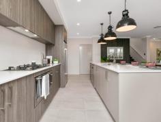 12 Gooljak Rise Lakelands WA 6180 The light and bright contemporary elevation is finished in neutral tones with gentle splashes of colour and a feature brick column in warm white for visual texture. A separate theatre room overlooks the streetscape to the front of the home, with the open plan Kitchen, Dining and Family areas tucked neatly behind. The walk in pantry is discretely positioned opposite the end of the island bench offering ample space & shelving, with the Laundry and Walk in Linen accessible from the Kitchen for ultimate convenience. Three good sized rear bedrooms are positioned off a rear wing – two with walk in robes, and the third with its’ own entrance passage and double sliding robe. The beautifully appointed upstairs Master Retreat with its own lounge, ample walk in robe and Ensuite with double vanity, presents more like a private studio than a bedroom. Located just 10 minutes (approx.) from Mandurah’s vibrant town center and marina, Lakelands is the perfect choice for anyone seeking a family-oriented community with an outstanding list of attractions on your doorstep. 