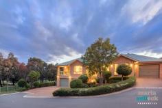  4 Newbu Pl, Ngunnawal ACT 2913 Occupying the prized Tenth Fairway position of the Peninsula Golf Course Estate with uninterrupted views across the tree-lined greens, this monumental builder's own residence offers space, comfort and relaxation. Built to the highest of standards, the brick home offers two-storeys of spaciously allocated living complete with multiple outdoor spaces for unwinding and taking in the stunning golf course views. Flowing from the front foyer, you´ll find the oversized formal lounge and dining rooms, a family and casual dining area set beneath cathedral ceilings and leading to separate outdoor entertaining areas, and at the heart of the home the expansive timber kitchen with top-end appliances and granite benchtops. For those needing extra space for entertaining, hobbies, or a home business, the lower level features a large rumpus and an enormous poolroom that leads to a private covered outdoor entertaining space. Accommodation includes five bedrooms, the double-size master with a walk-in-robe and spa ensuite, a second ensuite, two additional bathrooms, laundry, sauna, a double garage and a single garage. Surrounded by easy-care manicured gardens in one of Ngunnawal´s most enviable and tightly held positions, this exquisite family home won't last long.  Feature list: Located in the prized Tenth Fairway of the Peninsula Golf Course Estate Uninterrupted tree-lined views Incredibly spacious to suit even the largest of families Multiple indoor and outdoor entertaining areas Oversized formal lounge and dining rooms Open-plan family and casual dining area with cathedral ceilings Expansive timber kitchen with top-end "Miele" appliances and 40mm granite benchtops Lower rumpus room Huge pool room, perfect for teenagers, hobbies or a home business Five bedrooms Huge master bedroom retreat with a spa ensuite and a walk-in-robe Bedroom two with an ensuite Large bathroom Powder room for guests Large laundry with external access Large concrete verandahs Lower bathroom with sauna Ducted reverse-cycle heating and cooling throughout home, zoned Security system Ducted vacuum throughout Two hot water systems, 'Rinnai', with four separate temperature controls Extra large double garage, with three-metre openings Additional single garage, with a three-metre opening 'Buggy' garage on the lower level with separate remote access to golf course  Easy-care manicured gardens Terraced vegetable gardens Enviable and tranquil location 