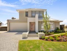  12 Gooljak Rise Lakelands WA 6180 The light and bright contemporary elevation is finished in neutral tones with gentle splashes of colour and a feature brick column in warm white for visual texture. A separate theatre room overlooks the streetscape to the front of the home, with the open plan Kitchen, Dining and Family areas tucked neatly behind. The walk in pantry is discretely positioned opposite the end of the island bench offering ample space & shelving, with the Laundry and Walk in Linen accessible from the Kitchen for ultimate convenience. Three good sized rear bedrooms are positioned off a rear wing – two with walk in robes, and the third with its’ own entrance passage and double sliding robe. The beautifully appointed upstairs Master Retreat with its own lounge, ample walk in robe and Ensuite with double vanity, presents more like a private studio than a bedroom. Located just 10 minutes (approx.) from Mandurah’s vibrant town center and marina, Lakelands is the perfect choice for anyone seeking a family-oriented community with an outstanding list of attractions on your doorstep. 