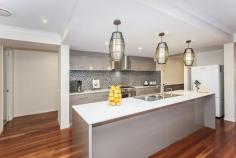  10 Carnoustie Way, Medowie NSW 2318 This cleverly modified Metricon "Grandview" home awaits the most discerning buyer. A selection of living areas provide versatility & the quality of the fittings & features will delight you as soon as you open the door. Also utilize "Pacific Dunes" amenities or join the first class golf course.  - Blue Gum timber flooring & plantation shutters featured  - Beautiful gourmet kitchen featuring Caeserstone tops, & butlers pantry  - Ducted air-con, fireplace, ceiling fans & ventis system  - Full ensuite to master, modern main bathroom & powder room  - Private alfresco are overlooking level 914m2 lot  - Oversized double garage with bonus workshop or cart storage  WHY WAIT AND BUILD? Built In Robes Dishwasher Ducted Cooling Ducted Heating Ensuite Floorboards Fully Fenced Open Fireplace Outdoor Entertaining Remote Garage Rumpus Room Solar Panels Workshop 