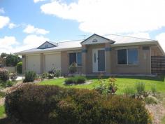  6 Torrisi Terrace, Stanthorpe QLD 4380 $375,000 In a  sought after residential area of Stanthorpe amid  other quality residences is this low set brick home just 12 years old and in immaculate condition. It offers 4 bedrooms ( or 4th study) all built in, main with ensuite and walk in robe. There is a separate lounge and an open plan casual living/dining with a wood heater plus an effective 4.5kw air conditioner. The adjoining electric kitchen with dishwasher has direct access to the double garage with remote control doors. Property has full security screens too and 3kw/350 litres solar hot water. The main bathroom has sep bath, sep shower, sep toilet and the nearby laundry has direct rear access. There is a delightful private N/E facing under cover casual area -  ideal for all year use PLUS a separate covered BBQ area which is also great for a family area/hobby space or just a get a way! Near this is another L/U garage for vehicle/mower/trailer/ workshop etc. There are 2 tanks, 2 pumps PLUS all town services and the property is fully fenced (colorbond) and has most attractive established gardens set on easy care generous 997m2. Nothing to do ....property and position are excellent....an ideal quality residence to appreciate NOW. Asking $375,000. Call Anne Lindsay on 0418 737309. 
