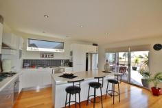  10 Seaview Ave, Merimbula NSW 2548 $728,000 Commanding an elevated & central position in Merimbula with panoramic “never to be built-out” views sweeping over the ocean, bay, lake, stretching to the mountains.  This home has been tastefully renovated while retaining its original charm. This impressive tri-level 4 bedroom home boasts spacious formal and informal open plan living areas opening to a large balcony  capturing the breathtaking views. The well appointed modern kitchen features a rock-solid benchtop and s.s. appliances. Beautiful polished timber floors are a feature of the home. The generous master bedroom also enjoys the wonderful views and has a large walk-through robe to a luxurious ensuite with spa bath. Two bedrooms are accessed at the entry level which includes a high-end bathroom with an oversize shower. The 4th bedroom is downstairs and has its own separate entrance, vanity and toilet. It opens to a covered deck – this room could also serve as a rumpus or guest accommodation. The property is beautifully landscaped and has a large double carport.  The backyard has a BBQ/entertaining area and backs onto a reserve that extends through to the lake & boardwalk. Offering modern amenity, amazing views, privacy and convenience to town this property is not to be missed!    Features Balcony  Verandah  Outdoor entertainment area  Fenced  Smoke Alarms  Ocean views  Inside Spa 