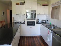  15 Yates St, Rosewood QLD 4340 $365,000 Perfect for the largest of families, this home has all that you need for years to come. Featuring 5 great sized bedrooms, there’s no doubt you can find room for the growing family here. The galley style kitchen is very tidy and functional and has a great big breakfast bar for meal preparation. The dining room is also on the plus size so don’t worry you will fit the family dining table in here. When it comes to movie night this place has it covered with the gigantic air conditioned lounge room that can accommodate a huge lounge suite. The bathroom is tidy and features shower over bath. This property has been home to a family of 9 so an internal paint job wouldn’t go astray, with this done you will have a finished off sturdy hardwood home that will last for generations to come. The 5kw solar system ( 20 solar panels ) & 14,000 gallon water tank storage (with the flick of a switch can service the house) will appeal to those wanting to save thousands every year on energy and water bills. Other features of the home include polished timber floors, large rumpus underneath which would make a great teen retreat, 5 car accommodation with 2 car spaces under the house, 6 x 9m powered shed with 2 bays and a carport, massive covered entertainment area that has only recently been paved and so much more . The generous 1012m2 block is fully fenced  and is great place for the kids and pets to play. Walking distance to Rosewood town centre, Schools, Parks and the train station this is definitely worth a look. So much value for money here!!! Call today to arrange your inspection. 