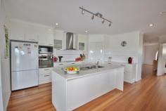  20 Trumpeter Ave, Eden NSW 2551 $668,000 Enjoy coastal living at its finest in this superbly presented 3 bedroom contemporary home, boasting beautiful ocean, bay and coastal views sweeping over Eden to the mountains. Featuring an enormous open plan living area which flows from the generous entry foyer through to the lounge & dining areas and then out through two large stacker sliding doors to extensive undercover alfresco desk areas. There is a separate theater room off the main living area. Fully equipped modern kitchen with large pantry, caesar stone bench tops & breaky bar and quality appliances. The generous master bedroom has a walk-in-robe and luxurious en-suite with separate bath & shower & WC. The 2nd bedroom is also large and has a walk-in-robe and also opens out onto the deck. The 3rd has built-ins. Quality main bathroom with separate WC. Plus there is a study nook. Double remote garage with internal access and downstairs is an enormous workshop/rumpus area which has potential for further bedrooms or possibly a flat.  Positioned on a gently sloping 1,260m2 fully fenced block. The property is just a short walk from the foreshore reserve to Lake Curalo and Aslings Beach.    