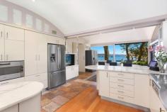  1a Loch Maree Ave,  Vaucluse NSW 2030 Exquisite Sydney Waterfront Home.A harbourside haven of leafy serenity bound by northern views across Vaucluse Bay and the harbour beyond, "Loch Maree" offers more than half an acre oA harbourside haven of leafy serenity bound by northern views across Vaucluse Bay and the harbour beyond, "Loch Maree" offers more than half an acre of blue ribbon real estate at the end of a prestigious cul-de-sac. This unique home is wonderfully versatile as the ultimate entertainer or private family residence. Featuring 6 bedrooms, 10 bathrooms, separate guest accommodation, boat house, boat ramp, harbour front pool and level access to all levels of the home, including the rooftop via a new high speed glass lift, this expansive family home allows for the most idyllic family lifestyle in one of the Eastern Suburbs most pristine and desirable locations.  - Choice of oversized living & dining areas - Sun soaked terraces - Generous master suite with walk-in robes - Self-contained boathouse with boat ramp - Home theatre - Self-contained office - High speed glass lift to all levels including roof - Harbour front pool - Championship tennis court - Secluded tree filled garden with level lawn - Garaging for six cars or more - Boat ramp to beach - Outside golf driving range - Internal Elevator - seprate maids quarters. 