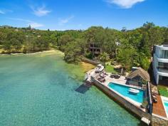  1a Loch Maree Ave,  Vaucluse NSW 2030 Exquisite Sydney Waterfront Home.A harbourside haven of leafy serenity bound by northern views across Vaucluse Bay and the harbour beyond, "Loch Maree" offers more than half an acre oA harbourside haven of leafy serenity bound by northern views across Vaucluse Bay and the harbour beyond, "Loch Maree" offers more than half an acre of blue ribbon real estate at the end of a prestigious cul-de-sac. This unique home is wonderfully versatile as the ultimate entertainer or private family residence. Featuring 6 bedrooms, 10 bathrooms, separate guest accommodation, boat house, boat ramp, harbour front pool and level access to all levels of the home, including the rooftop via a new high speed glass lift, this expansive family home allows for the most idyllic family lifestyle in one of the Eastern Suburbs most pristine and desirable locations.  - Choice of oversized living & dining areas - Sun soaked terraces - Generous master suite with walk-in robes - Self-contained boathouse with boat ramp - Home theatre - Self-contained office - High speed glass lift to all levels including roof - Harbour front pool - Championship tennis court - Secluded tree filled garden with level lawn - Garaging for six cars or more - Boat ramp to beach - Outside golf driving range - Internal Elevator - seprate maids quarters. 