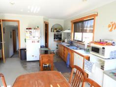  20 Cherrywood Dr Scamander TAS 7215 $365,000 (1817m2) This home sits within walking distance of the beaches, river, shops, hotel, post office, fishing, surfing and most of Scamander’s facilities. Upstairs offers 3 good sized bedrooms all with built-ins and the main with an ensuite, walk-in-robe, ocean views and deck access. The living  and dining area flow into each other and offers great space and deck access from both the dining and living areas. The main bathroom is spacious and has a spa bath, separate shower and timber vanity. Stairs lead to a very large rumpus/ games room or 4th bedroom. This area has its own  toilet and vanity, there are also 2 other utility rooms that run off the rumpus room. This area would be perfect for a teenager retreat or guest area. With some work it could be self-contained as it has its own access. There is also a double garage with carport at the rear of the property. All this sits on a large 1817m2 block with great established fruit trees and plenty of space for your boat or caravan. Good value here! 