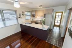  19 Campbell St Scarborough QLD 4020  $449,850 Chamferboard Charmer! This thoroughly charming post-war home will absolutely delight…character-filled with a blend of old-world ambience and new-world comforts, this will please those who appreciate a home with great heart and soul. All on one level for ease of maintenance and functionality; the home is complete with three bedrooms, stylish modern kitchen and bathroom, light-filled north facing sunroom at front, separate living and dining, separate tiled laundry, huge covered timber deck at rear, double carport, and separate powered shed/workshop in backyard, on an easy care 405m2 block with a child/pet friendly fenced backyard. Features that enhance warmth and appeal include: stunning hardwood timber floors and ornate plaster cornices; there is also air-conditioning and ceiling fans, and with a contemporary kitchen with dishwasher, and bathroom there are no big-ticket items to spend money on. The alfresco deck is a superb place for those weekend social gatherings…fire up the BBQ, chill the drinks, select your tunes, and invite around family and friends for laughter, good food and great company – many memories have been made on this back deck, and there are many more waiting to be made in coming years. Located within walking distance of the local primary school, parks, bus stops, cafes, and the Scarborough foreshore; this is a wonderful location for sea-changing downsizers or entry level buyers who are looking to embrace a relaxed Bayside lifestyle. Only 2.4 kilometres to Redcliffe and 30 kilometres to Brisbane – access to major urban amenities is relatively effortless, particularly via public transport. This truly is a cutie with lashings of appeal; if you are an aficionado of homes of this vintage, you will find this one…simply irresistible. Contact us to arrange your very own private inspection today. Open 7 days Phone 07 3203 6001 (24 Hours) OUR FAVOURITE FEATURES : • 	 Post-war charm & character with modern comforts • 	 3 bedrooms, 1-bathroom • 	 Stylish contemporary kitchen with dishwasher • 	 Separate dining, separate living, light-filled sunroom • 	 Huge rear deck for alfresco entertaining & relaxing • 	 Stunning hardwood timber floors, ornate cornices • 	 Air-conditioning, ceiling fans, double carport • 	 Lock-up powered shed at rear, perfect man-cave • 	 Child/pet friendly 405m2 easy care block • 	 Walk to beach, shops, cafes, bus, local schools • 	 Suit entry level buyers, downsizers & sea-changers! 