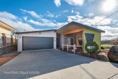  49 Premier Cir Spencer Park WA 6330 $495,000 A classy blend of contemporary building materials and bold colour makes this stylish home stand out from the crowd. It redefines modern living through its versatile layout offering a choice of living areas without compromising on the essentials demanded by today’s families. Viewing is necessary to really appreciate its many standout features and the convenient, comfortable lifestyle it offers. On the outside, muted lime green and smart grey weatherboard walls contrast with the angular charcoal roof. From its elevated site, the home takes in views towards Yakamia, around to Mt Melville and towards the city – the outlook shared by the living areas, an elevated rear deck and the kitchen, a well-appointed space with a dishwasher, great cabinetry and pantry. The new owners will be spoilt for choice when it comes to spreading out. There’s a sizeable family room and dining area, a separate air-conditioned TV lounge or theatre room, and in addition to the main home, there are two freestanding rooms at the rear. One of these is an air-conditioned and carpeted studio, ideal for a home-based business; the other is a sizeable storeroom to complement the under-house storage space and workshop. The air-conditioned master bedroom has a good-sized walk-in robe and dressing room as well as an en suite with a double shower, and the main bathroom has a shower, bath, vanity and toilet. The second bedroom is a double with a built-in robe and the third has two parts. One half is a double bedroom with a walk-through robe to a toilet; the other is an air-conditioned space with a small sink and cabinetry. With its own access, this is an ideal site for a home office or study, or a sitting room for family members needing a degree of independence. Also on the low-maintenance block of 674sqm, there’s a double garage at the front and street access to the studio from the rear. On a corner site in a quiet street a few minutes from town, this impressive home is also near medical facilities, shops and schools, and it’s all ready to delight a discerning new family. What you need to know: – 	 Classy family home, contemporary styling – 	 674sqm block, two-road access – 	 Views to Yakamia and Mt Melville – 	 Open living room – 	 Air-conditioned TV lounge or theatre room – 	 Elevated rear deck with views – 	 Sheltered front deck – 	 Attractive kitchen with dishwasher, pantry – 	 Air-conditioned master bedroom with dressing room and en suite shower room – 	 Main bathroom with bath and shower – 	 Second bedroom with built-in robe – 	 Third bedroom with walk-through robe to toilet, and adjoining private sitting room with kitchen and external access – 	 Freestanding studio or hobby room – 	 Freestanding store room – 	 Under-house storage and workshop – 	 Double garage with direct access – 	 Corner site within easy reach of town, schools, shops – 	 2017/2018 Water Rates $1,353.73 – 	 2018/2019 Council Rates $2,506.92 