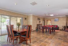  360 Summit Road, Mundaring, WA 6073 $719,000 Everything is in place to ensure you make the most of life on this 1-acre property. A wonderful, large 4 bedroom, 2 bathroom home with open plan living, generous bedrooms, a spectacular high-gabled paved alfresco with views of lawn and formal gardens and a fabulous 3-phase powered workshop. 4 bedrooms 2 bathrooms 1996-built brick and iron Vast open kitchen, living Large sunken loungeroom Sunny, airy studio / study Gorgeous jarrah benchtops Spectacular alfresco living Scheme, tank, bore water 1-acre, 3 phase workshop Minutes from Mundaring Generosity – room to move, play, grow, learn and work – infuses this home. Ideally placed, in every way, moments from the Mundaring Village, within easy reach of transport links, a choice of schools and arterial roads, this elegant 4 bedroom, 2 bathroom home, sits in a landscaped garden with a backdrop of gorgeous native vegetation and is sure to suit your family now and into the future. A circular drive surrounds a planting of citrus, herbs and an ornamental pear tree to create a striking first encounter. The home sits elegantly at the centre of the property – back from the road and elevated. An enclosed carport with roller door is arranged to one side of the home. A stain-glassed entry opens to a sunken lounge with views of rose bushes and the native landscape. A wonderfully restful space, generous proportions and plush carpets, perfect space for quite evenings at home or formal entertaining. Step up from the lounge room to the bright studio space. With French doors to the northern verandah and windows to the west, this room is an ideal workspace for artists and crafters. The spacious master suite, features a walk in robe, patio access, and a big, bright ensuite with a storage alcove. An impressive open plan kitchen / family room is incredibly comfortable and inviting thanks to warm-toned slate floors and gorgeous solid jarrah bench tops. A slow combustion fire, ceiling fan and high ceilings reinforce the feeling that this is a space designed to be the centre of family life. The kitchen contains a free standing 900mm Emilia oven, dishwasher, walk-in pantry and ample storage. The wide bench top forms a long breakfast bar and large windows wrap the corner of the room to deliver views of the gorgeous surrounds. Along the eastern side of the home is an impressive 9.2m x 6m paved, alfresco terrace. Covered by a high-gabled roof, the views of the garden, lawn and curved sandstone walls produce a restful and beguiling outdoor living area. The open plan family room leads to the junior wing, which includes two large bedrooms with built-in wardrobes, that offer views to the alfresco terrace and a third bedroom or study room. A large family bathroom with bathtub, separate shower and vanity is arranged with a separate W.C adjoining the walk-through laundry. Follow the lawn, past the wisteria and along the sandstone garden walls to reach the large, shed with 3-phase power. Vehicle access and a turning circle make for a practical workshop, double sliding doors, a side entrance and a bathroom with separate septic system ensure this approximately 15 m x 8 m space is adaptable to many uses. Beyond the property’s rear boundary is a wildlife corridor and bridle trail. A perfect balance of garden, bushland views and outdoor living, the landscaped gardens host established fruit trees, ornamental blossom trees and rose bushes. Set against a background of native vegetation, the effect is enchanting and wonderfully Australian. Maintaining the garden is made easier through the use of a reticulated bore and 43K litre tank. Generous, bold, yet unpretentious, the spacious home offers stylish living. Solid family-ready fixtures and high end finishes give a sense of enduring quality. Solar panels, established gardens, ducted evaporative cooling, bore water and proximity to Mundaring Village support a sustainable lifestyle for years to come. 