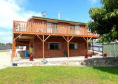  20 Cherrywood Dr Scamander TAS 7215 $365,000 (1817m2) This home sits within walking distance of the beaches, river, shops, hotel, post office, fishing, surfing and most of Scamander’s facilities. Upstairs offers 3 good sized bedrooms all with built-ins and the main with an ensuite, walk-in-robe, ocean views and deck access. The living  and dining area flow into each other and offers great space and deck access from both the dining and living areas. The main bathroom is spacious and has a spa bath, separate shower and timber vanity. Stairs lead to a very large rumpus/ games room or 4th bedroom. This area has its own  toilet and vanity, there are also 2 other utility rooms that run off the rumpus room. This area would be perfect for a teenager retreat or guest area. With some work it could be self-contained as it has its own access. There is also a double garage with carport at the rear of the property. All this sits on a large 1817m2 block with great established fruit trees and plenty of space for your boat or caravan. Good value here! 