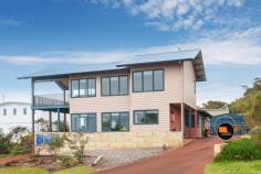  3 Galliers St Gracetown WA 6284 $1,335,000 Here is your chance to secure a fantastic family beach home perched high in Gracetown, with mesmerising elevated views of all the surf breaks within the Bay, including south towards the Ellen Brook stretch of coastline. Boasting a modern design and custom built by a reputable local builder this is a very attractive residence. Orientated to take advantage of the north facing solar passive aspect with outside living areas tucked out of the prevailing winds, this is a very inviting home to enjoy as a holiday house or comfortably as a permanent residence. Easily accommodate a large family and/or guests with dual living areas both upstairs and down.  Featuring a master ensuite retreat upstairs equipped with a full kitchenette, open plan lounge/living which flows onto the elevated viewing balcony. Wake up to amazing ocean views from the bedroom, check all the surf breaks and ocean conditions before planning your day. From the second storey you can relax and watch the whales migrating with stunning views extending beyond the shipping lanes, simply mesmerising. Downstairs has a generous sized kitchen with functional open plan living areas that also take in ocean views. Three bedrooms, a well-appointed bathroom and easy care tile floor throughout make it an easy lock and leave. From inside you can also access the undercover outside area and both the rear and front yard separately. Enjoy the walk-in benefits of a fenced backyard and lockable large Colorbond shed, dual water tanks, solar panels and bituminised driveways. This property is well set up and ready to enjoy for generations of summers to come. An easy walk down towards the beach through the shortcut path at the end of Galliers puts you on Osborne St in no time, close to the shops and caf, no effort for the kids to walk to the surf or beach without having to get in the car. Property features: * Outstanding panoramic views * Locally designed and custom built  * Dual kitchens (main downstairs and kitchenette upstairs) * Upstairs master bedroom with ensuite, open plan living, balcony to soak up spectacular panoramic views * Four bedrooms with master ensuite retreat * Modern bathrooms with separate w/c's * Fully fenced backyard, bituminised driveway  * Secure Colorbond shed large enough for car and gear * Solar panels, dual water tanks * Reverse cycle air conditioning * Quiet street location * Great permanent or holiday residence * Short stay income potential, subject to Council approvals A contemporary beach residence, very well located with many features you wouldn't normally find in a Gracetown beach house worthy of your consideration. Contact David Cross your Gracetown Real Estate Specialist today on 0439 496 926 to organise a private inspection. 