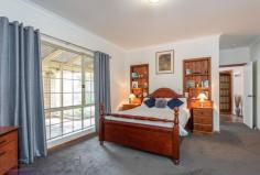  360 Summit Road, Mundaring, WA 6073 $719,000 Everything is in place to ensure you make the most of life on this 1-acre property. A wonderful, large 4 bedroom, 2 bathroom home with open plan living, generous bedrooms, a spectacular high-gabled paved alfresco with views of lawn and formal gardens and a fabulous 3-phase powered workshop. 4 bedrooms 2 bathrooms 1996-built brick and iron Vast open kitchen, living Large sunken loungeroom Sunny, airy studio / study Gorgeous jarrah benchtops Spectacular alfresco living Scheme, tank, bore water 1-acre, 3 phase workshop Minutes from Mundaring Generosity – room to move, play, grow, learn and work – infuses this home. Ideally placed, in every way, moments from the Mundaring Village, within easy reach of transport links, a choice of schools and arterial roads, this elegant 4 bedroom, 2 bathroom home, sits in a landscaped garden with a backdrop of gorgeous native vegetation and is sure to suit your family now and into the future. A circular drive surrounds a planting of citrus, herbs and an ornamental pear tree to create a striking first encounter. The home sits elegantly at the centre of the property – back from the road and elevated. An enclosed carport with roller door is arranged to one side of the home. A stain-glassed entry opens to a sunken lounge with views of rose bushes and the native landscape. A wonderfully restful space, generous proportions and plush carpets, perfect space for quite evenings at home or formal entertaining. Step up from the lounge room to the bright studio space. With French doors to the northern verandah and windows to the west, this room is an ideal workspace for artists and crafters. The spacious master suite, features a walk in robe, patio access, and a big, bright ensuite with a storage alcove. An impressive open plan kitchen / family room is incredibly comfortable and inviting thanks to warm-toned slate floors and gorgeous solid jarrah bench tops. A slow combustion fire, ceiling fan and high ceilings reinforce the feeling that this is a space designed to be the centre of family life. The kitchen contains a free standing 900mm Emilia oven, dishwasher, walk-in pantry and ample storage. The wide bench top forms a long breakfast bar and large windows wrap the corner of the room to deliver views of the gorgeous surrounds. Along the eastern side of the home is an impressive 9.2m x 6m paved, alfresco terrace. Covered by a high-gabled roof, the views of the garden, lawn and curved sandstone walls produce a restful and beguiling outdoor living area. The open plan family room leads to the junior wing, which includes two large bedrooms with built-in wardrobes, that offer views to the alfresco terrace and a third bedroom or study room. A large family bathroom with bathtub, separate shower and vanity is arranged with a separate W.C adjoining the walk-through laundry. Follow the lawn, past the wisteria and along the sandstone garden walls to reach the large, shed with 3-phase power. Vehicle access and a turning circle make for a practical workshop, double sliding doors, a side entrance and a bathroom with separate septic system ensure this approximately 15 m x 8 m space is adaptable to many uses. Beyond the property’s rear boundary is a wildlife corridor and bridle trail. A perfect balance of garden, bushland views and outdoor living, the landscaped gardens host established fruit trees, ornamental blossom trees and rose bushes. Set against a background of native vegetation, the effect is enchanting and wonderfully Australian. Maintaining the garden is made easier through the use of a reticulated bore and 43K litre tank. Generous, bold, yet unpretentious, the spacious home offers stylish living. Solid family-ready fixtures and high end finishes give a sense of enduring quality. Solar panels, established gardens, ducted evaporative cooling, bore water and proximity to Mundaring Village support a sustainable lifestyle for years to come. 