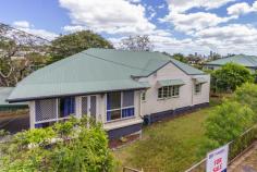  14 Majestic Outlook Seven Hills QLD 4170 After 36 years ownership the current owners have decided  to offer their Family home to  the market Currently  tenanted until  June 2019 at $480  per  week Master bedroom has large en suite plus reverse cycle Air con Air con to large dining / kitchen Covered deck with city glimpses to rear  of  property Large 10,000  water  tank  to  side of  property Post war  home on 736 sq m with Frontage of 26.4 meters All this  in such a convenient  location 170 Meters  walk to a City bus 700 Meters  to  local  Primary  school 1200 Meters  to City Train 4 Kilometers  to Church of England Grammar School 8 Km to  Brisbane  City 16 Km to Brisbane  Airport A great site  to develop your new home with City Views  or just enjoy what is already here 