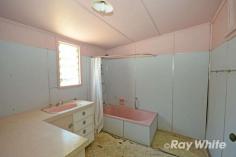  52 Kroombit Street Biloela, QLD 4715 $114,000 With a location of sheer convenience, this little gem does need some work.but the potential, like the location, is fabulous! 2 bedrooms, separate air-conditioned lounge, kitchen and a large sleep-out (third bedroom) just for starters. Large, level, fully fenced allotment on the fringe of the CBD has a shed, rainwater tank and an array of fruit trees in the back yard. Time to put your renovator's hat on and get to it! This one is potential plus! FEATURES: • Air Conditioning • Close To Shops 