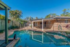  19A Warrina Street Geebung QLD 4034 $679,000 Private Oasis - Park side living! Here is a chance to upgrade your family lifestyle and enjoy the spoils of this unique residence.  The flowing open plan design with large living areas will ensure effortless, entertaining and a relaxed lifestyle with direct access to Kath Ballard Park. This brick and tile family home is dominated by a choice of living areas which flow seamlessly to the outdoor entertaining area and in-ground salt water swimming pool.  The spacious kitchen will delight all chefs in the family and has plenty of storage space & gas cook top & complete with dishwasher. The master bedroom has a walk-in robe and ensuite, the remaining four bedrooms allow plenty of room for the family to move & grow. Immaculately presented home on a fully fenced 779m2 allotment, outstanding additional features of this comfortable family retreat include: • 	 Outdoor undercover entertaining area • 	 In-ground salt swimming pool.  • 	 Split system air conditioning in living areas  • 	 Ceiling fans throughout  • 	 Built-in wardrobes in all bedrooms  • 	 New carpet installed in all bedrooms & living area • 	 Double lock up remote garage with side access.  • 	 Security screens & Crimsafe front door.  • 	 Cubby house & Water tank  • 	 Built in approx 1998 • 	 BCC Rates $353.04 per quarter • 	 Direct park access  The location is perfect and only 12kms from Brisbane CBD, offers easy access to schools, parks and transport (all with-in walking distance), is a short drive to Chermside shopping center, airport, gateway motorway, hospitals and all of the must-have conveniences, this home is truly amazing. 
