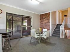  13 Corina Avenue Bolwarra Heights NSW 2320  $499,000 - $535,000 STRIKING AND SPACIOUS With a striking facade and plenty of character inside and out, this lovely Bolwarra Heights home is ideal for anyone looking for something a little different. Set on an elevated block, the home’s versatile layout makes the most of its location with a deceptively large internal footprint spread over three levels. The split level upper floor has been designed in two separate zones, with the entry level consisting of three living areas and the kitchen, while the upper level offers three bedrooms and a bathroom. A large lounge room sits at the front of the home, with an oversized picture window allowing plenty of natural light to flood into the south-west facing space while also showing off the view over the rooftops to the farmlands beyond. A ceiling fan will keep the room cool in summer, while a gas bayonet will allow you to keep it toasty warm in winter. Another large window allows you to make the most of the picturesque aspect in the formal dining room across the other side of the foyer, while an exposed brick feature wall gives the room a rustic feel. These rooms can be closed off from the rest of the house by a sliding cavity door, which also provides access to the open plan kitchen and meals area at the rear of the home. The large u-shaped kitchen is a light and modern space, with white panelled cabinetry and a white tiled splashback providing a bright contrast again the black laminate benchtop and dark grey flooring. Stainless steel appliances add to its contemporary feel while a corner pantry and breakfast bar complement its practical layout. The adjoining casual meals area provides a convenient dining space for families, with a sliding door connecting to the covered and screened alfresco area allowing you to easily cater for larger gatherings outside. The meals area also provides access to short set of steps, which lead upstairs to the private bedroom wing. The split level design provides the perfect separation between the home’s living and sleeping zones, ensuring the older members of the family won’t disturb younger children once they have gone to bed. This area includes two bedrooms, both with built-in wardrobes, as well as a generously-sized master suite complete with a large walk-in wardrobe and spacious ensuite with oversized shower recess. A practical three-way bathroom is also located on this level, with a wide vanity including underbench cabinets and a large linen cupboard providing plenty of storage space. The fourth bedroom, situated on the lowest level of the home, also includes a built-in wardrobe, while an adjacent living room and third bathroom in the laundry make this area perfect for a separate teenager’s retreat, or private granny flat for members of the extended family. A carpeted staircase provides access to the upper levels, while an internal door to the oversized double garage, and a sliding door to a sunken courtyard provide additional entry points to this space. The property’s long list of features continues outside, with an expansive covered alfresco area framed by lush, climbing vines providing plenty of room for year-round entertaining, while children will love the large lawn area at the rear and cute weatherboard cubby house to the side of the house. Manicured garden beds, established trees, clipped hedges and bamboo screening provide added privacy in the backyard, while a large gate opening out into the adjoining reserve provides convenient side access. Perfectly positioned on a prime block in the sought-after suburb of Bolwarra Heights, this lovingly maintained split level home offers a peaceful and spacious forever home for families, with easy access to playgrounds, sporting facilities and schools in the neighbouring suburbs of Bolwarra and Largs. The suburb is well positioned in a quiet area within reach of the larger surrounding townships, with Morpeth and East Maitland just 10 minutes away, the regional retail and entertainment hub of Stockland Green Hills shopping centre a 15 minute drive and the beaches of Newcastle and the vineyards of Pokolbin an easy 40 minute commute. SMS 13Corina to 0428 166 755 for a link to the on-line property brochure.  Kitchen Rumpus Room Built In Robes Air Conditioning Broadband Dishwasher Pet Friendly Outdoor Entertaining Area Fully Fenced Electric Hot Water. 