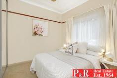  29 Edgbaston Rd Beverly Hills NSW 2209 $750K to $800K Close to station. 5 mins walk Ideally set opposite Edgbaston Reserve, this invitingly styled and tastefully updated period semi promises peace, privacy and light filled living space in abundance. With perfect proportions for family living and relaxed indoor /outdoor entertaining. 300m stroll to trains, shops, cinema and a variety of restaurants. Expansive open plan living with lounge area 4.8m x 4.3m and dining 3.4m x 4.1m (with skylight) extending fluidly through sliding glass doors to outside. Large level block with lush lawns and alfresco courtyard. Immaculately presented in contemporary neutral tones, ornate cornices, picture rails, recessed feature wall. Stylish kitchen equipped with stainless steel appliances- gas stove, dishwasher & pantry. Two oversized bedrooms PLLUS external bedroom/office/rumpus room (with air con). Internal laundry with separate toilet and 2nd shower. Renovated bathroom. Plentiful storage, timber flooring, and air conditioning. Double off-street parking. Close to schools, M5, Roselands Centro and short drive to Hurstville. 