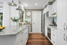  43 The Gully Road Berowra NSW 2081 $1,150,000 - $1,250,000 CONTEMPORARY ENTERTAINER IN CONVENIENT AND QUIET LOCATION Desirably situated on a flat 691sqm approx. block, this generously proportioned single level residence occupies a coveted lifestyle address set amongst landscaped gardens in a private and quiet leafy street. Showcasing a stunning union of vast open plan and formal living areas, luxury appointments and low maintenance gardens. This home provides year round North facing alfresco entertaining designed for effortless modern family living within walking distance to the station, shops and schools. Elegant formal living with leafy outlook and new LED lighting throughout Designer galley style kitchen with gas cooking, pendant lights and vast bench space Open plan dining with additional living area flows to outdoor entertaining Four well appointed bedrooms all with built in robes, master with walk in robe and ensuite Recently painted internally and externally throughout Expansive outdoor entertaining with Merbau decking and pergola Salt water inground pool with tiled paving and solar heating Beautifully landscaped gardens with level lawn areas, garden shed Oversized double lock up garage with separate workshop area Air conditioning, timber flooring and excellent storage. 