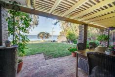  262 Estuary Road Dawesville WA 6211 Jo-Ann Yandle presents . . . Super Stunning Location - Estuary Views What an opportunity to invest in this sought after location! The outlook from this property is breathtaking and one will always enjoy sitting out the front and watching the estuary action. This comfortable 3 bedroom 2 bathroom brick and tile home is on a generous 1012 sqm block. This gives you ample room should you wish to extend and provides you with a secure backyard for children and pets to play. The front of the property has expansive estuary views, just a short walk across the road to the waters edge. Crabbing doesn’t get any easier than this. Boating, fishing, kayaking, swimming, the choice is yours. Enjoy a waterside walk to the Leprechaun Deli for a coffee or a bite to eat. FEATURES OF THIS PROPERTY INCLUDE: * 3 bedrooms 2 bathrooms 2 wcs * Lounge and dining room with estuary views * Galley kitchen with plenty of bench space, 900mm stove and pantry * Family room with wood fire * Ducted evaporative air-conditioning * Solar hot water * Full length rear patio * Front pergola entertaining area. * Bore and reticulation * Septic – sewer passes * 1012 sqm block * Built in 1978 * Shire Rates: approx. $1600.00 * Water Rates: approx. $1235.72 This is your unique opportunity to secure a waterfront property in the leafy Dawesville precinct,over looking the pristine peel estuary. Charm, Character and Charisma. Enjoy the beautiful views all year round. 