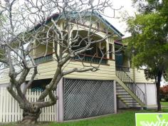  59 Brisbane Road Newtown QLD 4305 $515,000 Boasting a high profile Newtown location and offering multiple potential uses, this property will appeal to owner occupiers seeking dual living arrangements or even business owners having your home and business is one conveniently located property*. The property consists of two separate dwellings with the main house offering Federation style with original character features including polished floors, fretwork & arches, colour glass windows and French doors. Offering 2 bedrooms with a large enclosed sleep out (potential 3rd bedroom or study), open plan lounge/dining area with character features. With a neat and tidy timber kitchen as well as modern family bathroom this property will satisfy your needs. The main property offers a single lock up garage and fenced yard. The bonus of this property is the stand alone second dwelling. This dwelling is a self-contained 2 bedroom property. Offering 2 bedrooms with built-ins, modern kitchen and bathroom with single lock up garage. This property has its own street entrance. The dwellings sit on a fully fenced 822 sqm parcel of land in a prominent corner position. The property is centrally located within walking distance to bus stop and train stations as well as local schools and amenities. This property offers so many opportunities to a potential owner*. The dwellings are currently tenanted returning $285/week on dwelling 1 and $280/week on dwelling 2. 