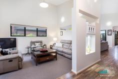 35 Zanci Street Crace ACT 2911 Style, Convenience and Comfort Relax and stretch out within this spacious single-storey home set amongst other quality properties in one of the north's most sought-after suburbs. Close to Canberra City, Gungahlin CBD and Belconnen, as well as nature reserves, this ideally located home offers easy living that doesn't compromise on style, convenience or comfort. Inside you'll find flowing open-plan living with a dramatic roofline that provides sumptuous 4.6m ceilings to the formal lounge and family rooms sloping down to the foyer, light-filled dining room and exquisite kitchen complete with 'Caesarstone' waterfall benches, walk-in-pantry and high-end appliances. The ample use of glass throughout allows for plentiful sunlight and views outside to the easy-care manicured gardens where you can entertain year-round with ease in the magnificent undercover alfresco dining area and adjacent BBQ area. Accommodation includes four large bedrooms all with built-in-robes, segregated master bedroom with stunning ensuite, three-way bathroom, and spacious separate laundry. Other features of this wonderful home include instant hot water, camera security system, intercom, and ducted heating and cooling. This great family home is a must to experience.  Spacious single level home Short drive to Gungahlin CBD, Belconnen or the City 4.6m ceilings to main living areas Formal lounge off foyer Open-plan family and dining room Exquisite kitchen with top-end appliances, walk-in-pantry and waterfall 'Caesarstone' benches 'Electrolux' induction cooktop, 'Smeg' oven and 'LG' dishwasher  Ample use of glass providing light-filled spaces and views to the easy-care manicured gardens Magnificent undercover alfresco dining area with adjacent undercover BBQ area  Four large bedrooms all with built-in-robes Segregated master bedroom with stunning ensuite Large three-way bathroom Spacious laundry Instantaneous hot water Electric roller shutters to formal lounge and master bedroom Concealed ceiling fans in master bedroom and family  Camera security system Intercom Zoned and ducted heating and cooling Good sized shed With a great location in a quality suburb and endless features, this great family home is a must to experience. 