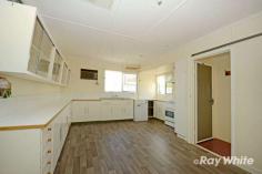  2 Manton Street  Biloela  QLD 4715 $179,000 Fully fenced, 870* square metre allotment with double gates to allow vehicle access to the rear yard and shed. Spacious kitchen and dining combo. Living room with timber floors and ceiling fan. 3 bedrooms all with ceiling fans. Built-in robes in the main. Separate downstairs laundry. Separate office or 4th bedroom. 3 x 3*metre lawn locker. 4 bay, 12* metre x 6* metre shed with 3 roller doors and sliding, glass door as well as personal access door. Quiet street within walking distance to sporting fields, swimming pool and schools. 