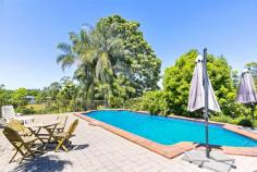  50 Elizabeth Street NAMBOUR QLD 4560 Huge block, huge home close to town. This delightfully large family home features open plan living with a mix of formal, casual and outdoor entertaining areas. The approx. 300m2 home offers 4 good size bedrooms, 2 bathrooms a large laundry with plenty of cupboard space and a walk in linen closet and that’s just the beginning.  From the moment you walk through the over-sized entry way you will start to appreciate the size and space of this home. The formal lounge offers a great area for relaxing or could be used for an extra living area for the kids. The large 7m X 7.5m sunroom has views to the south and west through the abundance of windows that also flood the room in light. This room runs directly off the main living area of the home with plenty of room for a large dining table to seat the whole family and features a fireplace.  The perfectly located kitchen offers a 5 burner gas cooktop, 900mm oven and double fridge space. Add to that the ample cupboards and extra deep bench tops makes this kitchen functional for the largest of families. Leading straight out from the kitchen is the covered patio with access to the large 65,000L pool, perfect for entertaining the family and friends.  The immaculate elevated 2400m2 block features beautiful gardens, mature trees, garden sheds and a 5000L water tank. It also allows options to add a large shed or even a second dwelling permitting council approvals. This property has all the features you want for a grand family home and is located close to schools, shops and public transport and still only 20 mins to the beach.  FEATURES  • 	 5kw Solar  • 	 NBN available  • 	 Formal Lounge  • 	 Large Sunroom  • 	 Huge family pool with heating options  • 	 Large covered patio  • 	 Fireplace  • 	 Air conditioning  • 	 900mm Gas cooktop  • 	 2 Garden Sheds  • 	 5000L Water Tank  • 	 315l Hot water system  • 	 Huge 2400m2 block  • 	 Second dwelling options  