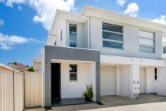  6/100 Findon Road  Woodville West SA 5011 This dual level townhouse enjoys a fluid and easy-care layout and is set on low maintenance grounds. The epitome of convenient effortless living, presenting an open plan lower level living, three generous bedrooms and valuable rear lane access to the undercover carport for two vehicles. An enviable opportunity for first home buyers, astute investors, empty nesters and those seeking to downsize. Positioned on Findon Road with many conveniences and amenities including an abundance of public transport links, and walking distance to The Queen Elizabeth Hospital, West Lakes Shopping Centre and short driving distance to the beach. Open plan lower level living with tiled flooring for easy maintenance Kitchen with stainless steel appliances including oven, gas cooktop and range hood Three bedrooms, master with ensuite & other with built in robes Separate laundry with external access and additional lower level w.c. and toilet Ducted reverse cycle air conditioning Outdoor entertaining overlooking low-maintenance grounds Rear access to the left of the home. 