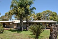  27 Todman Rd Coonabidgee WA 6503  Come and enjoy the fresh air..bore...and water tanks....6 Acres of Prime Land with excellent potential for Truck Storage Yard plus a 4 bedroom 2 bathroom residence with wrap around verandahs, two rev. cycle air conditioners, 20 solar panels, 5 water tanks holds 30,000gals. 1/4 of the property is auto reticulated with it's own bore 60x40 shed/workshop and the list goes on...... Located just off Brand Hwy. north of Muchea or Joondalup.  In the shire of Gingin.  Jusr 65km from Joondalup. This property is a very rare find in prime sort after area. This is a real find once the new Darwin Hwy. or North Link is completed making accessing the city much quicker and convenient, but still within easy proximity to shops etc. 