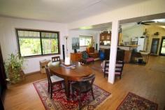  1235 Old Tully Road Maadi QLD 4855 $295,000 * Tropical and peaceful property * Spring fed creek plus bore! * Rainforest plus some fruit trees Getting back to nature is said to be good for the soul. Why not treat yourself to a space where you can relax and enjoy the best that nature has to offer. This 10,000m2 (1 hectare) property is very private and peaceful with rainforest gardens and mature fruit trees scattered throughout the yard. Fresh water will never be an issue, with a spring fed creek running along the rear boundary of the property, plus the advantage of an operational bore. As you make your way down the picturesque driveway to the quaint 2 bedroom home, you'll feel like you are miles away from everything. Yet, the conveniences of Tully and the beauty of Mission Beach are only a 15 minute drive away. Key features of the property include: * 2 good sized bedrooms with built in robes * Open plan living / dining * Separate media room with built in lounge seat * Solid kitchen overlooking the living area, with electric oven and cooktop * Timber decking area for entertaining friends and family * Double carport + workshop area * New awnings, gutters, insulation and ceiling fans * Large water tank that can be filled from the bore (via pump) * Spring fed creek running along the rear boundary * Lush gardens - a mix of rainforest, formal gardens and lawn. 