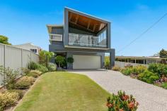  9A Wilson Esplanade Victoria Point QLD 4165 STEP INTO THIS CONTEMPORARY AND UPMARKET BEACHFRONT STYLE HOME, THIS IS NOT JUST A VIEW, THIS IS A LIFESTYLE CHOICE. YOUR NEW HOME IS JUST A METRES TO THE WATER OFFERING SPACIOUS LIVING & HIGH END FITTINGS. LOW MAINTENANCE, EXECUTIVE LIVING OVERLOOKING THE EVER CHANGING SEASCAPE OF MORETON BAY AND ACROSS THE WATER TO VICTORIA POINT AND THE ISLANDS BEYOND * The stunning architectural design will be the second thing you notice once you can tear your eyes away from the view * Impressive high ceilings & open plan living create a fantastic feeling of space that greets you from the moment you step inside * Polished internal timber stairs with frameless glass handrails and lighting beckon you into the heart of the home * 5 generous sized bedrooms complete this home with two up and three down for privacy and versatile living * The master suite is truly impressive & offers a sizable walk in robe & a striking ensuite with double vanities and oversized shower * Elegant stone benchtops in the kitchen and bathrooms, 90cm stainless steel Smeg upright gas/freestanding oven and range hood * The expansive sliding glass doors allow your living area to flow seamlessly through to the covered balcony and provides the perfect view of the beach and Bay so you can capture the cool breezes at all times * Ducted air conditioning throughout provides all year round comfort * 2 generous sized living rooms include: one up and one down * Polished timber floor on upper level and an easy to maintain tiled floor on the downstairs level. * Study nook * Security system * Intercom system * Vacu-maid system * Double lock-up garage with plenty of built-in storage * With electric gate your privacy is assured * Low maintenance landscaping is perfect for the traveler or busy families * Local shops, cafes and the ferries to the many bay islands are just a short stroll away. * No fuss access to the boat ramp so you can make the most of your water playground. WORDS CANNOT DESCRIBE THE FEELING OF BOTH THE INSIDE AND OUTSIDE OF THIS LIGHT FILLED AND SPECTACULAR HOME. WITH VIEWS FROM MANY VANTAGE POINTS THROUGHOUT YOUR YOUR NEW PLACE TO CALL HOME IS TRULY MAGNIFICENT. THIS HOME WILL NOT LAST LONG SO DON'T LET THE DREAM SLIP AWAY CALL TANYA FLOOD ON 0449 579 299 TO ORGANISE YOUR INSPECTION TODAY. 