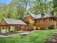  59 Cove Boulevard North Arm Cove NSW 2324 $565,000 - $620,000 Wake up to the sound of birdsong and take a short stroll to the water’s edge from this charming western red cedar cottage, perfectly located in the peaceful seaside hamlet of North Arm Cove. Surrounded by natural bushland and just minutes from the coast, the fully furnished four bedroom home offers a versatile range of lifestyle options, whether you’re looking for a weekend escape far from the hustle and bustle or seeking a more permanent sea-change amongst a tight-knit coastal community. Built in 2001 using western red cedar cladding and cypress pine piers, the tri-level home combines storybook charm with a more contemporary interior, featuring an appealing mix of natural textures and neutral tones. Exposed timber beams provide a warm contrast to the crisp white raked ceilings, enhancing the feeling of light and space throughout, while gleaming Tasmanian oak cabinetry gives the kitchen a traditional cottage ambience. The home features four bedrooms, with the master suite on the upper level of the house providing the perfect parents’ retreat. Facing the front of the property, it offers filtered water views that can be enjoyed from its own private east-facing deck, which is the perfect place to sit and enjoy an early morning coffee while watching the sun rise. A huge three-door built-in wardrobe and ensuite-style access to the adjoining bathroom add to its appeal, while further down the hall another generously-proportioned bedroom includes a walk-in wardrobe and views of the backyard. Two additional good-sized bedrooms are located on the lower level of the home, with a second bathroom, large walk-in storage cupboard and compact yet practical laundry. Both bathrooms have been beautifully styled with soft, neutral tones and timber accents, with a vintage style freestanding claw foot bath and gooseneck mixer tap the focal point of the main bathroom. The home’s expansive living areas are all located on the middle level, with fabulous indoor-outdoor connections to a covered L-shaped verandah at the front and large open timber deck at the rear. Sliding door access to the verandah, a high dormer window and soaring raked ceiling ensure the lounge room is a lovely, light-filled space, while cypress pine flooring and a wood-burning fireplace in one corner give it a cosy, comfortable feel. The timber flooring flows through to the adjoining dining room and open plan kitchen, which both look out over the rear deck to the lush, green landscape beyond. A peaceful and private home that makes the most of its elevated setting to capture the nearby water views, the property is ideally located just a short walk from the local community hall and tennis courts, which are a hub for local events, a social tennis competition and yoga sessions. Access to North Arm Cove itself is also within walking distance, with the picturesque Casuarina Park around 800m north of the property. A wonderful place for children to play or families to picnic, the park features barbecues and tables as well as kayak and dinghy storage racks and direct access to the sheltered waters of the bay, which are perfect for a refreshing paddle, water sports and fishing. The twin seaside towns of Hawks Nest and Tea Gardens are just a 15-minute drive, providing all your essentials, while 20 minutes to Newcastle Airport will put a host of domestic destinations including Melbourne, Brisbane and Adelaide a direct flight away. The major centres of Newcastle and Maitland can be reached in around 50 minutes, while the heart of Sydney is an easy two-and-a-half hour 
