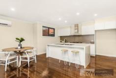  1/4 MOUNTAIN ASH AVENUE ASHWOOD VIC 3147 A brand new street-front town residence has become available in Ashwood showcasing luxurious proportions, sublime finishes and exceptional functionality.  Encompassing elements and carefully considered details, this residence provides a unique dual zoned layout flowing from a light-filled lounge, a spacious open plan living/dining zone and high-end galley-style kitchen boasting stone surfaces, Bosch appliances and walk-in pantry.  Enjoy the versatility of ground floor and first floor main bedrooms, each with a designer ensuite, complemented by 2 further robed bedrooms, teenage retreat and stylish fully-tiled bathroom. Split system heating/AC, powder room, alarm system, video intercom, timber floors, entertaining courtyard and double garage are amongst the additional assets of a home certain to establish a new benchmark.  Located for lifestyle convenience, close to Ashwood College, Parkhill Primary, Gardiners Creek parkland, Ashburton Village, Chadstone Shopping Centre and transport. 