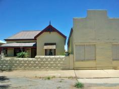  53 Nichols St Broken Hill NSW 2880 $140,000 Comprising the towns original butcher shop with ample parking. The home has been renovated and includes good floor coverings, pressed metal ceilings, evaporative air cooling, three bedrooms, large bathroom with bath, separate shower and vanity, large internal laundry/toilet with spacious lounge room which has been arched into the kitchen/dining area. There is a back foyer with linen press and broom cupboard, a back verandah and second toilet. This is a feel good home with lots of natural light. As a bonus the old shop could easily be converted to a teenager retreat, extra bedrooms or a granny flat or office if wishing to work from home (subject to relevant approvals). This is a very versatile property with plenty of character. Close to Centro Plaza and local school. 
