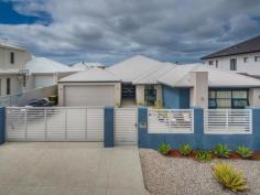  12 Whitehorses Drive Burns Beach Burns Beach WA 6028 $950,000 A 5-minute walk down to the beach and in close proximity to the Burns Beach Caf hotspot and miles of pathways for walking or cycling while taking in the breathtaking sea views this coastline offers, what more could a you ask for! This home is so easy to maintain that it feels like you are on holiday every day.  A stone aggregate driveway and frontage creates a lovely courtyard that is fully fenced and boasts electric gates. The double garage has roller door access to the back yard. A Double door entry welcomes you into the foyer, the convenient shopper's entrance to the left and a short passageway to the right, leads to a separate wing of the house boasting 3 bedrooms all with built in robes. Two of the rooms are queen size and the 3rd a luxurious king size. All bedrooms have ceiling fans, a blessing on those hot summer nights.  A spacious guest w/c with vanity is situated next to a ginormous walk-in linen closet which is across from a vast double door cupboard - this home is not short on storage space! The teen retreat / study zone has the facility to plumb in hot and cold water enabling a kitchenette to be built creating a granny flat if desired. The family bathroom is tiled from floor to ceiling and boasts a 3rd w/c. The decor and finishes are all neutral and stylish, pure understated elegance.  Through double French doors into the open plan kitchen, dining and sitting rooms you will find the ample galley styled kitchen with 3 modern stainless-steel pendants hang over the Corian seamless bench top. Ample cupboards with an integrated Miele dishwasher, a 900mm gas hob, space for a double door plumbed in fridge and a massive walk in pantry with power points. The modern laundry is accessed from the kitchen and has sliders out to the courtyard. The media room is enormous and comes complete with a projector and huge screen, easily closed off from the rest of the house. Movie buffs will surely be impressed. The master suite is last but not least - king sized luxury with walk in robe, a slider out to a courtyard, also boasting a beautiful en-suite with a large slipper styled bath, floor to ceiling tiles and dual vanity, the epitome of sumptuous living. A perfectly sized study or parents retreat is a great compliment to this adult space.  The outdoor alfresco area is just as impressive with a built in BBQ, stainless steel bench, sink and cupboards. Concrete pavers and effective gauze blinds that keep the sun and strong breeze at bay. The glass enclosed pool has a gentle waterfall adding to the tranquillity. The open plan living area has full views out to the pool area to keep an eye on the little people.  This is the perfect home for large families, extended families, professional couples or even down sizers looking for the ideal beach side location and travel lifestyle which offers separate space for visiting family and friends. Some of the impressive features are: • 	 Inground, salt chlorinated, concrete pool with solar heating. • 	 Reverse cycle, zoned air con • 	 Fully alarmed  • 	 Trunk wiring in media room for network access • 	 3 phase power • 	 Blackbutt engineered timber flooring throughout living areas • 	 All bedrooms carpeted.  • 	 Rheem instant hot water • 	 Additional plug sockets in laundry as well as pantry. • 	 Secure parking for 4 cars. 