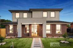  1/4 MOUNTAIN ASH AVENUE ASHWOOD VIC 3147 A brand new street-front town residence has become available in Ashwood showcasing luxurious proportions, sublime finishes and exceptional functionality.  Encompassing elements and carefully considered details, this residence provides a unique dual zoned layout flowing from a light-filled lounge, a spacious open plan living/dining zone and high-end galley-style kitchen boasting stone surfaces, Bosch appliances and walk-in pantry.  Enjoy the versatility of ground floor and first floor main bedrooms, each with a designer ensuite, complemented by 2 further robed bedrooms, teenage retreat and stylish fully-tiled bathroom. Split system heating/AC, powder room, alarm system, video intercom, timber floors, entertaining courtyard and double garage are amongst the additional assets of a home certain to establish a new benchmark.  Located for lifestyle convenience, close to Ashwood College, Parkhill Primary, Gardiners Creek parkland, Ashburton Village, Chadstone Shopping Centre and transport. 