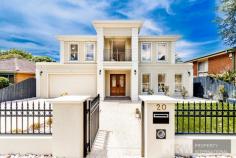  20 HEADINGLEY ROAD MOUNT WAVERLEY VIC 3149 Radiating refined elegance, this indulgent double storey residence blends its opulent scale with lavish fittings and quality craftsmanship to create a home like no other in the sought-after Mount Waverley Secondary Zone. Inspiring easy living, decedent double doors open to reveal a lengthy entrance hall that draws you past the study, formal lounge and private theatre room all adorned with comforting carpet. Graced by glamorous floorboards, the indulgent kitchen, meals and family room showcases waterfall stone benches, a window splashback, high-end cabinetry and appliances, a desired 2nd kitchen plus a convenient breakfast bench. Connecting to this space, entertainer's will appreciate the inclusion of a covered alfresco entertaining zone with outdoor kitchen set-up, while the low-maintenance backyard presents space for children to play.  Ensuring the family's every desire is met, the upper level comes with a wonderful retreat/living room and hosts four of the five bedrooms (all with walk-in-robes and individual ensuites), including the master with concealed robes, balcony and lavish ensuite, further complemented downstairs by a guest bedroom with walk-in-robe and ensuite, laundry and powder room. Highlighted by ducted heating, refrigerated air conditioning, alarm, high ceilings, gated driveway access plus a double garage with internal access. 