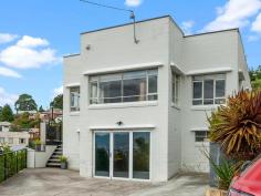  7 Dumas Place Moonah TAS 7009  $545,000 From the moment you arrive you know this home has that little something special. 7 Dumas Place Moonah is 123 M/2 of solid brick construction and is perfectly positioned on a 673 M/2 Allotment. Inviting to the eye you enter the property via a short flight of stairs onto a terrace style deck capturing all day sun and perfect for entertaining or admiring the panoramic views. The deck extends onto a perfectly level, secure and low maintenance garden. Steps also lead down to a lower garden with the most magnificent walnut tree. You enter the home from the deck into a central hallway. Off to the side is a light and sunny formal lounge with high ceilings and great views. One of the homes outstanding features is the perfect polished floorboards in each room. There is a separate dining and modern kitchen with white gloss joinery, granite bench tops and quality appliances. The home has 3 bedrooms in total with full length built-ins to the master. The family bathroom is modern and comes with shower enclosure, vanity unit and toilet. Towards the back door is a full height window bringing the outside garden inside. This flows onto the second bathroom with full length bath and incorporates the laundry. Down stairs has parking for 3 cars at street level and access to a large utility room and storage area via full height glass doors. This area is perfect for hobbies, workshop or guests to stay. Interesting feature is the vintage tram spiral stairs leading to the linen cupboard above. This tastefully styled home is truly one of a kind and is minutes away from the central hub of Moonah. Transport, shops, cafes and shopping centres are only walking distance away. It's real hard to find a property more central like this one and being only 15 Minutes (Approx.) away from the Hobart CBD. This one truly has it all. Call to book in your inspection today of come to one of our scheduled open homes. 